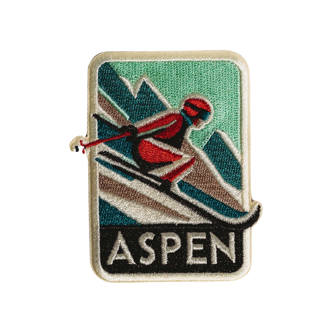 Aspen Colorado patch featuring a skier on a green and blue background with mountains and the word "ASPEN" at the bottom.