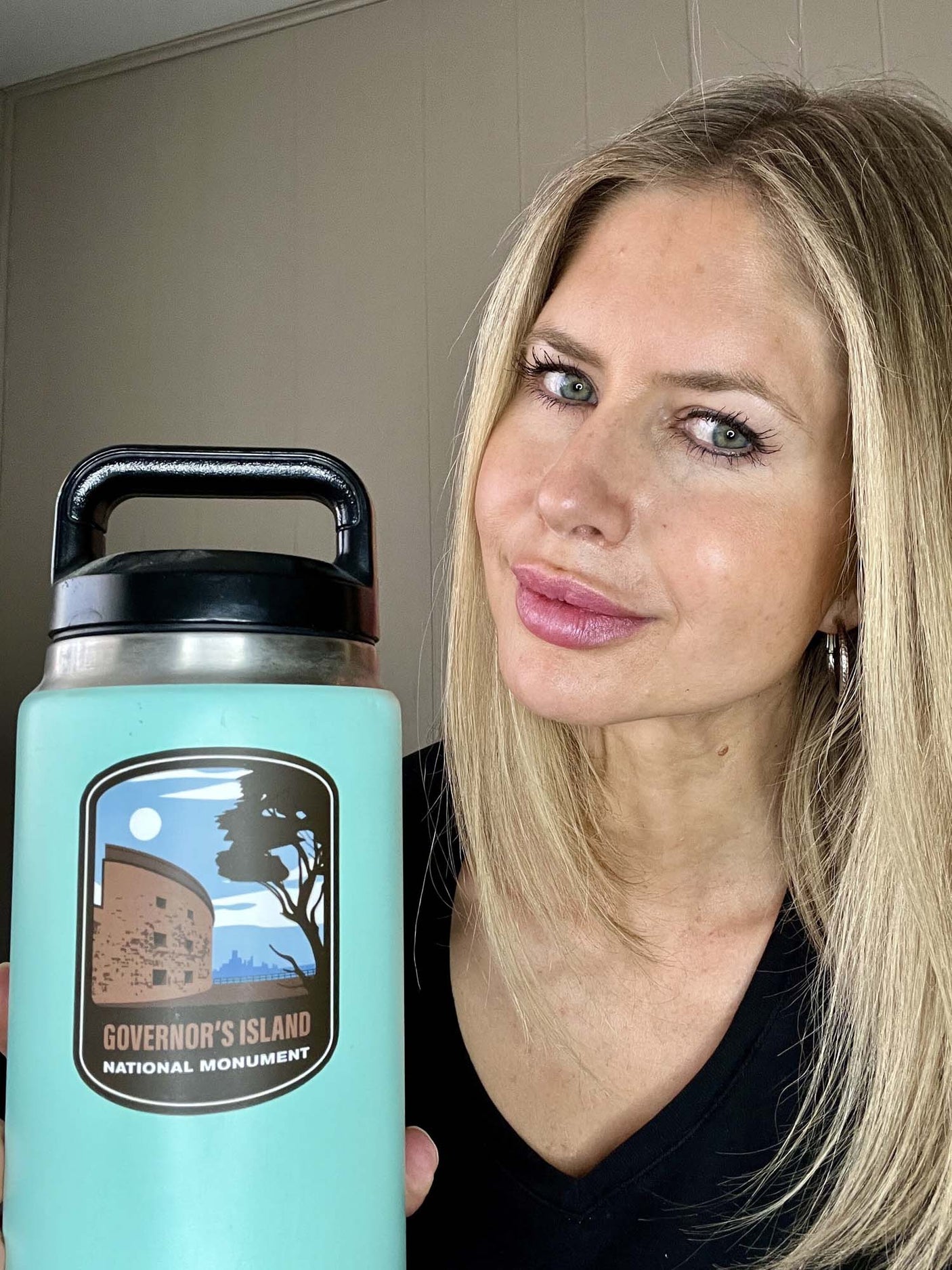 Governor's Island National Monument vinyl sticker on a turquoise water bottle, featuring a scenic design and text.