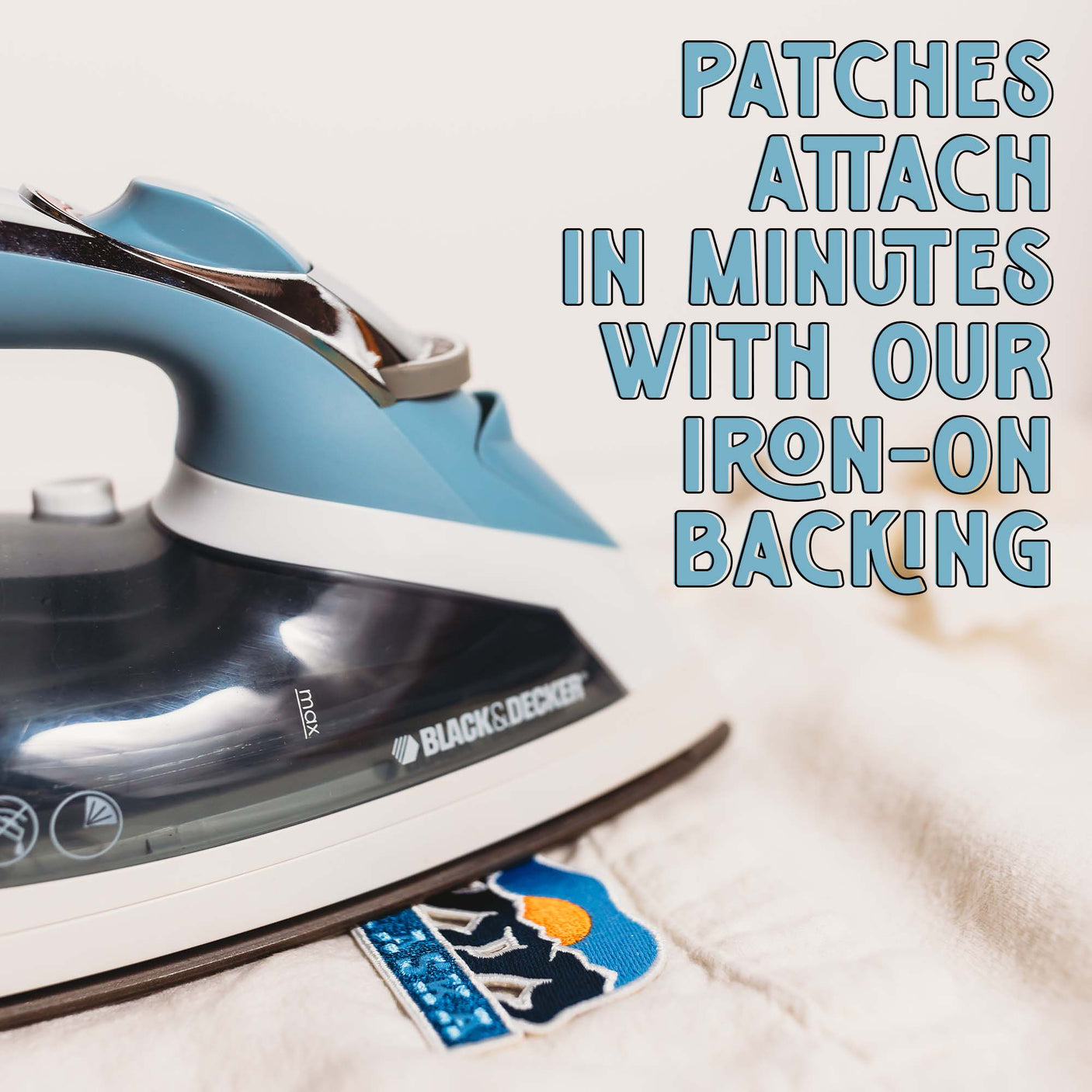 Ireland patch with a blue iron, showcasing the patch's design and iron-on backing on a light fabric.
