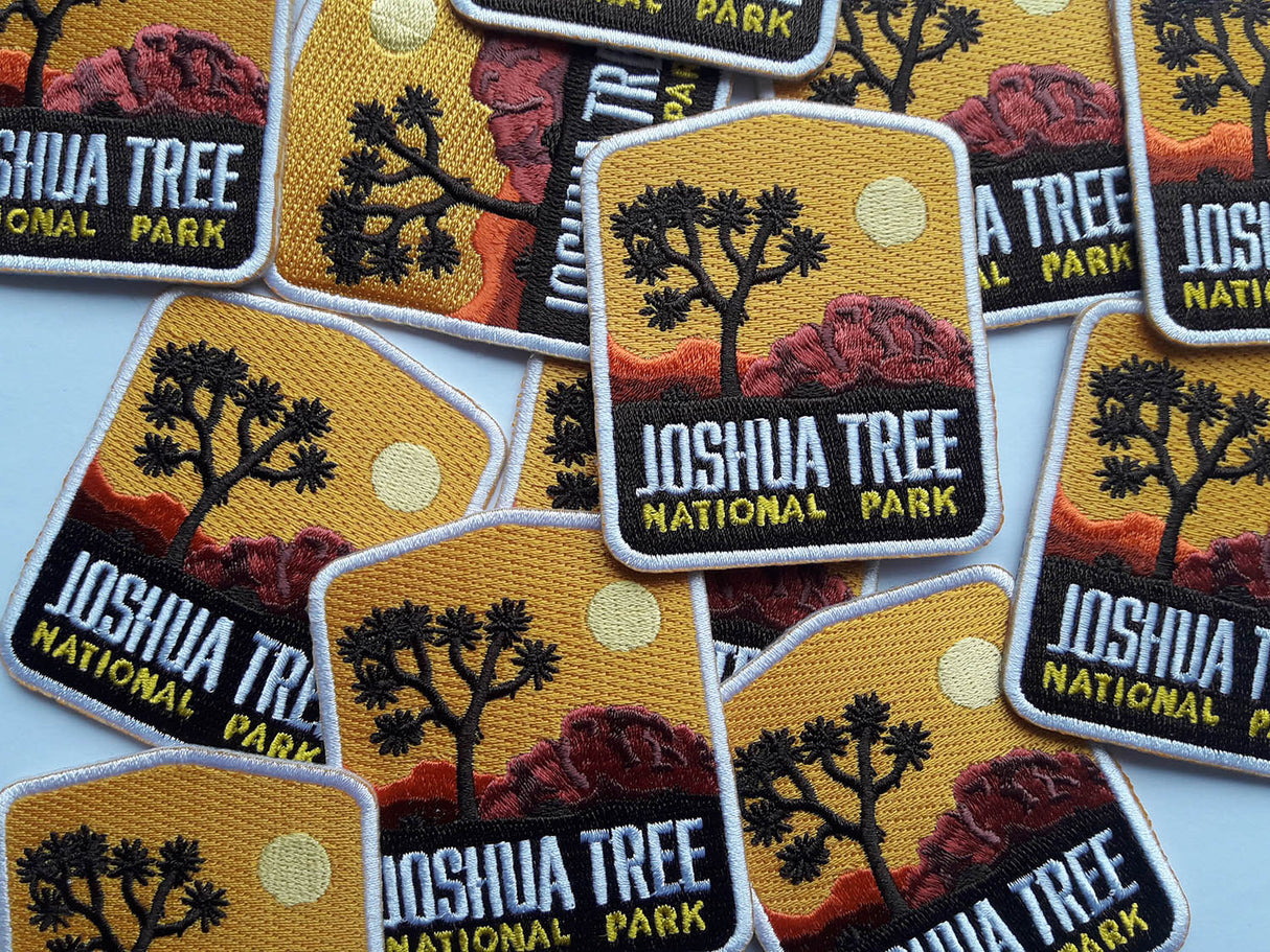 Joshua Tree National Park patches in various colors, featuring a tree silhouette and desert landscape design.