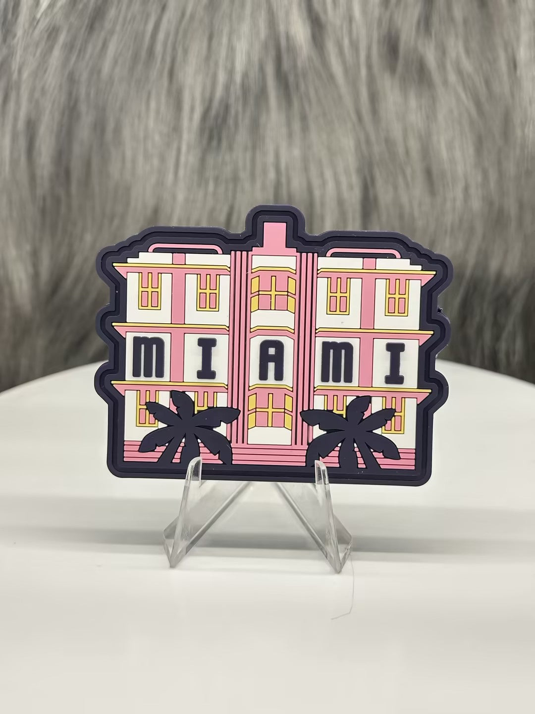 Miami Florida PVC fridge magnet featuring a pastel-colored Art Deco building with palm trees.