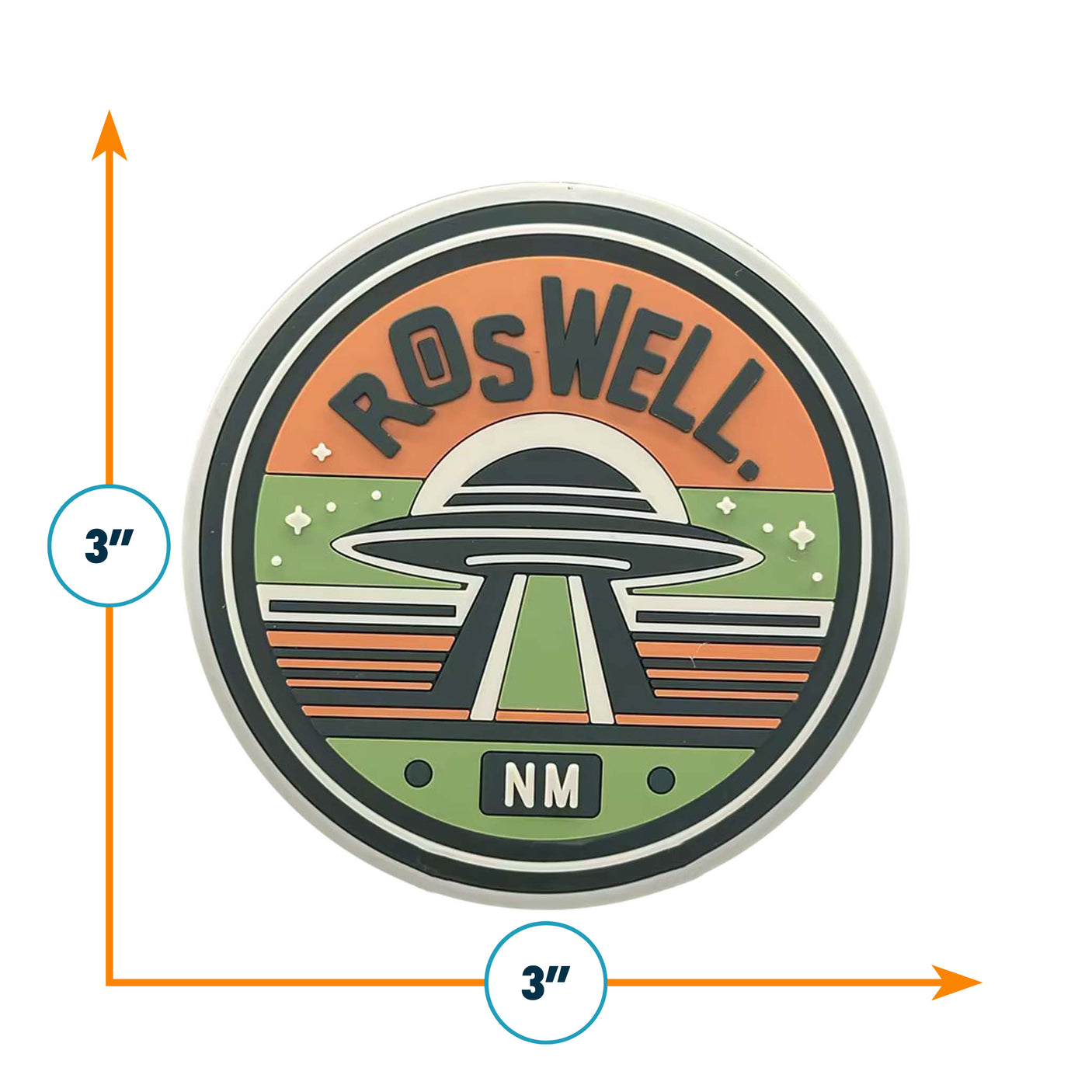 Roswell, NM PVC fridge magnet featuring a UFO design with orange, green, and black colors, measuring 3 inches in diameter.