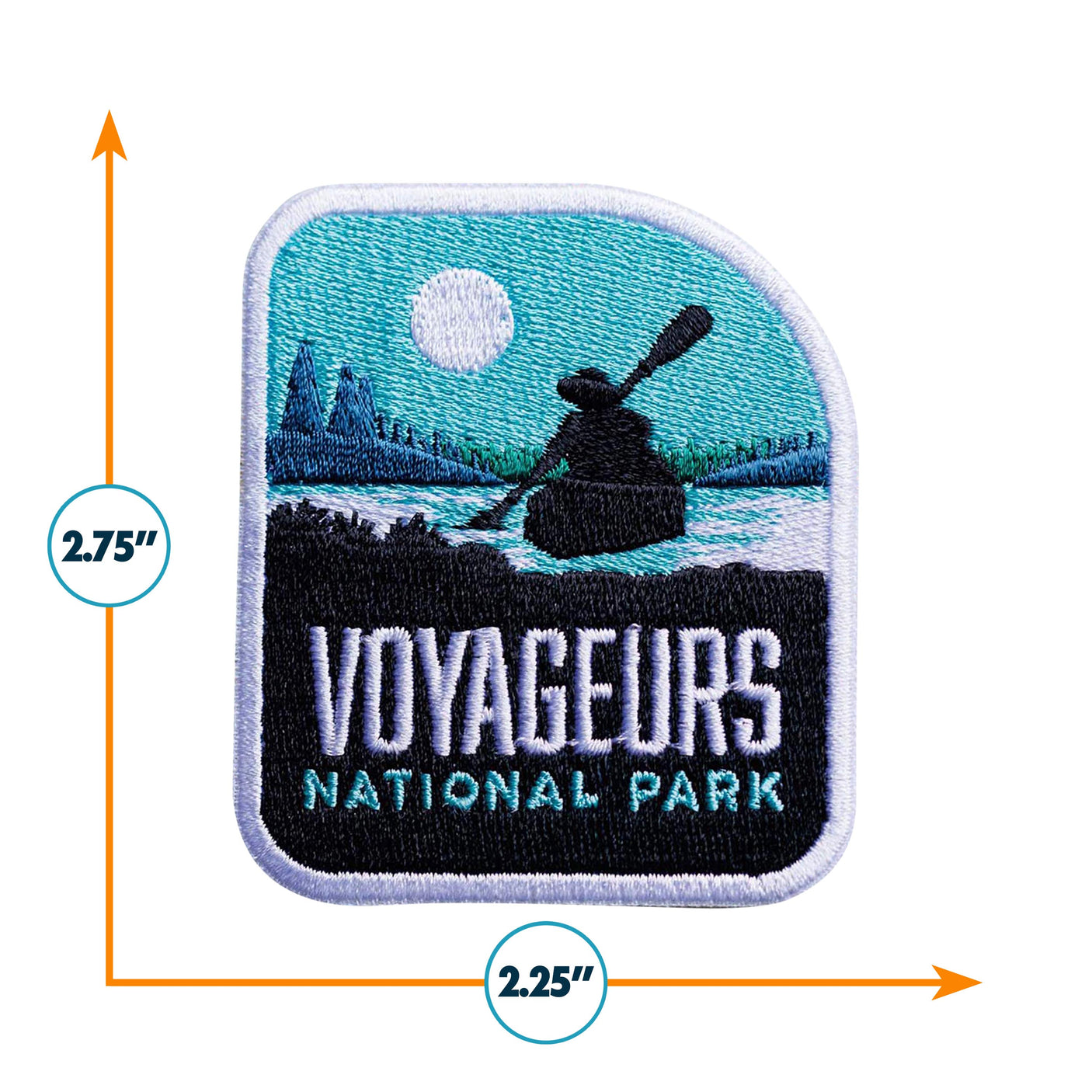 Voyageurs National Park patch featuring a canoe silhouette, mountains, and a sunlit sky, measuring 2.75 by 2.25 inches.