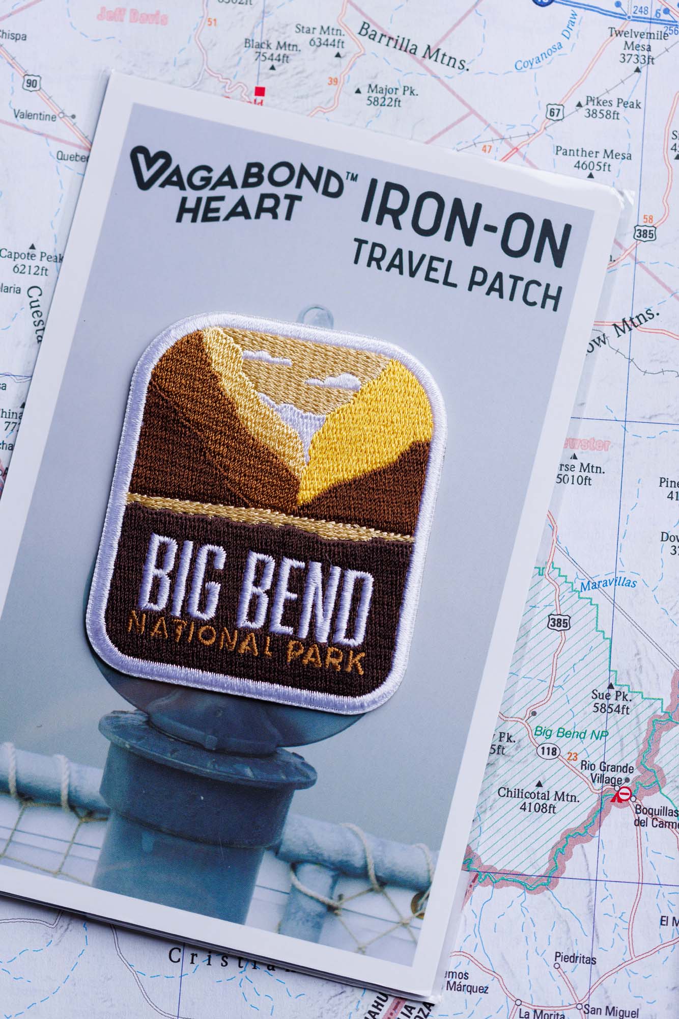 Big Bend National Park patch on a backing card with a brown and yellow design featuring mountains and text.