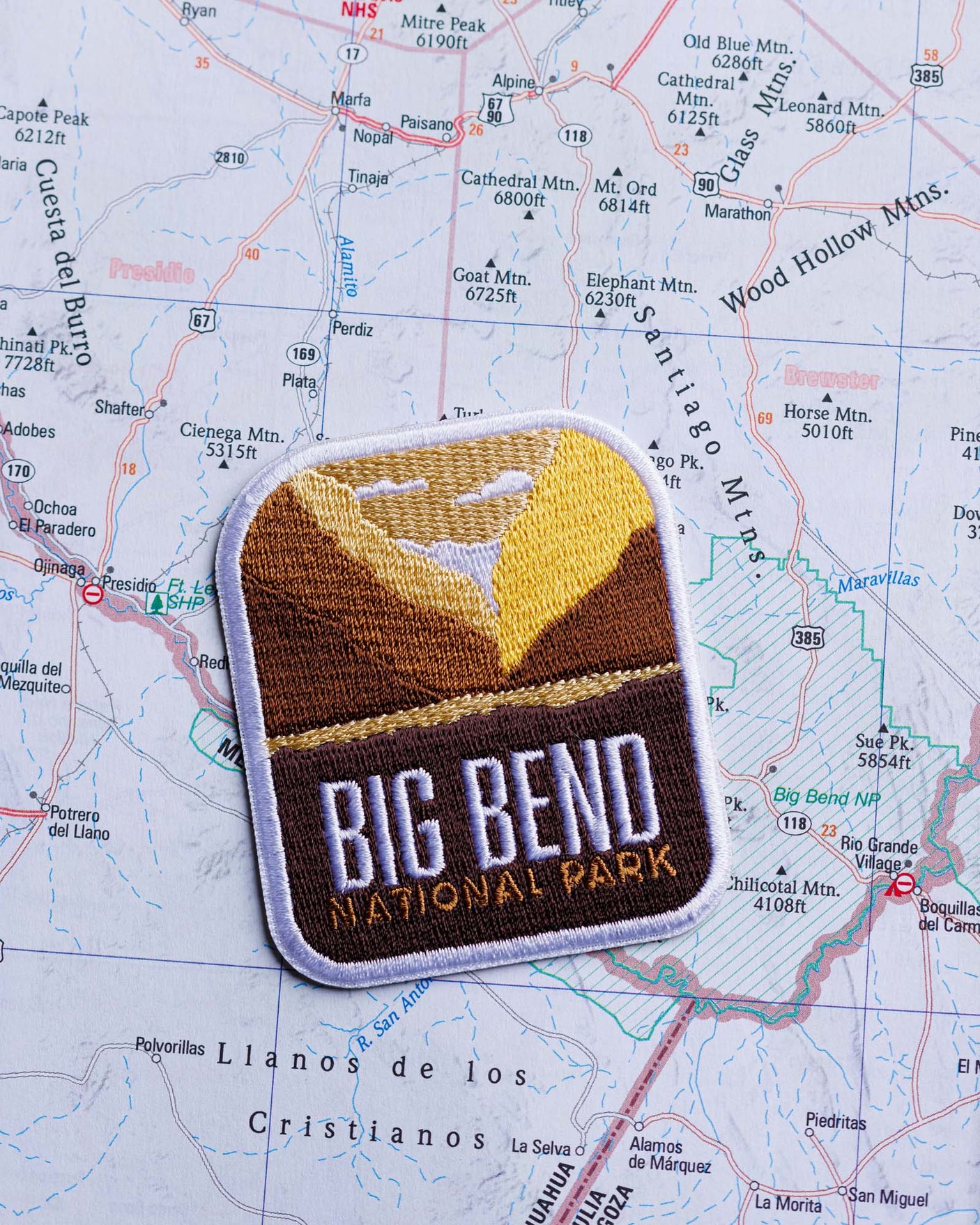Big Bend National Park patch featuring mountains and a river on a detailed map background.