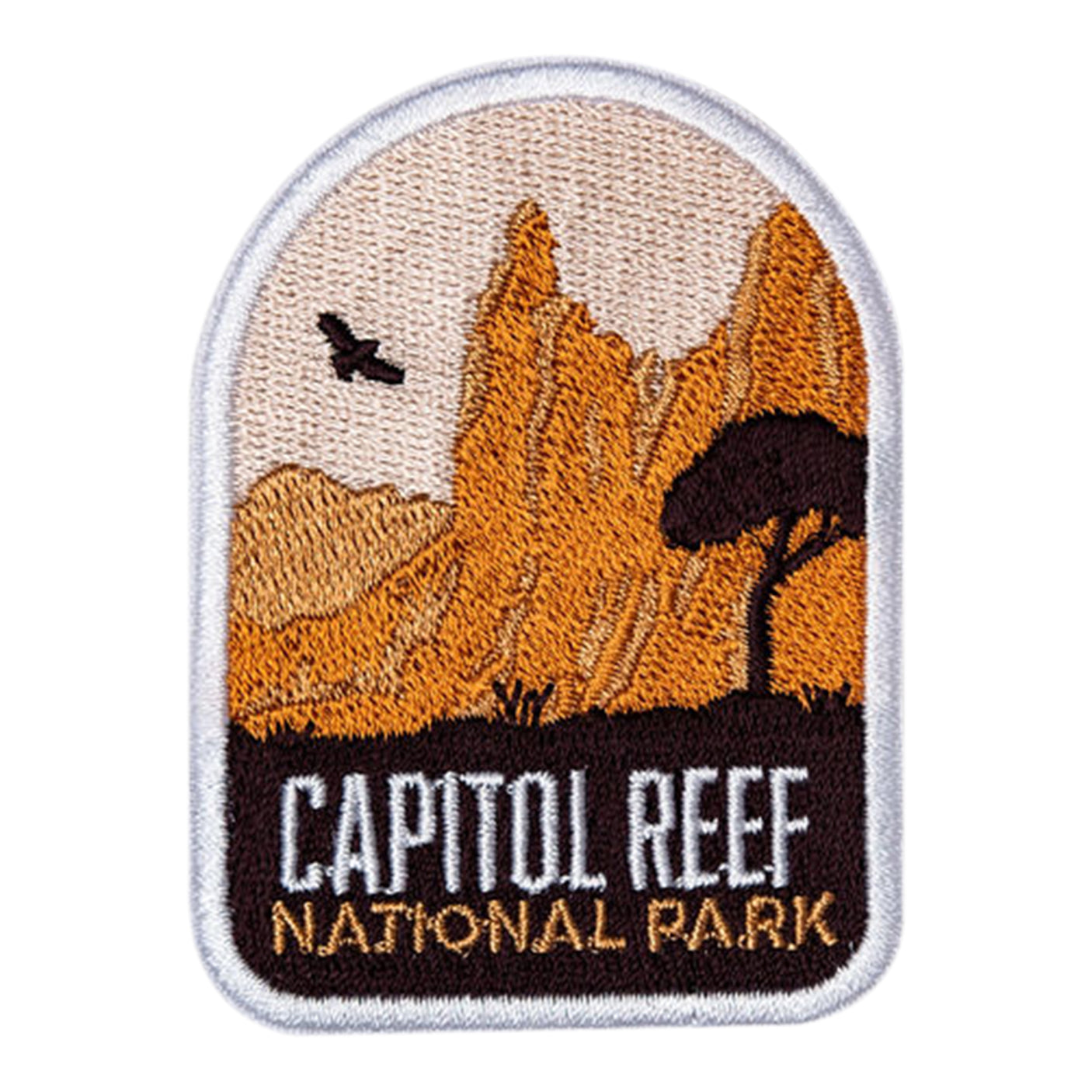 Capitol Reef National Park patch featuring orange mountains, a tree silhouette, and embroidered text at the bottom.