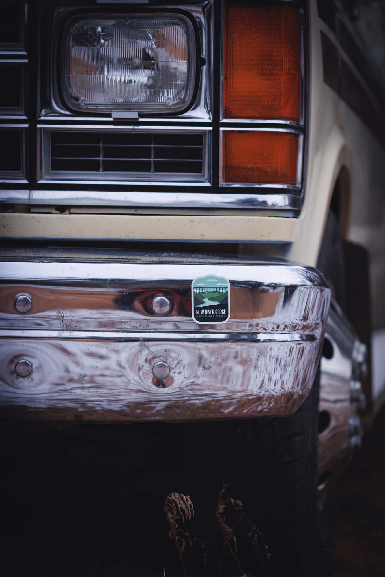 New River Gorge National Park sticker on the chrome bumper of a vintage vehicle.