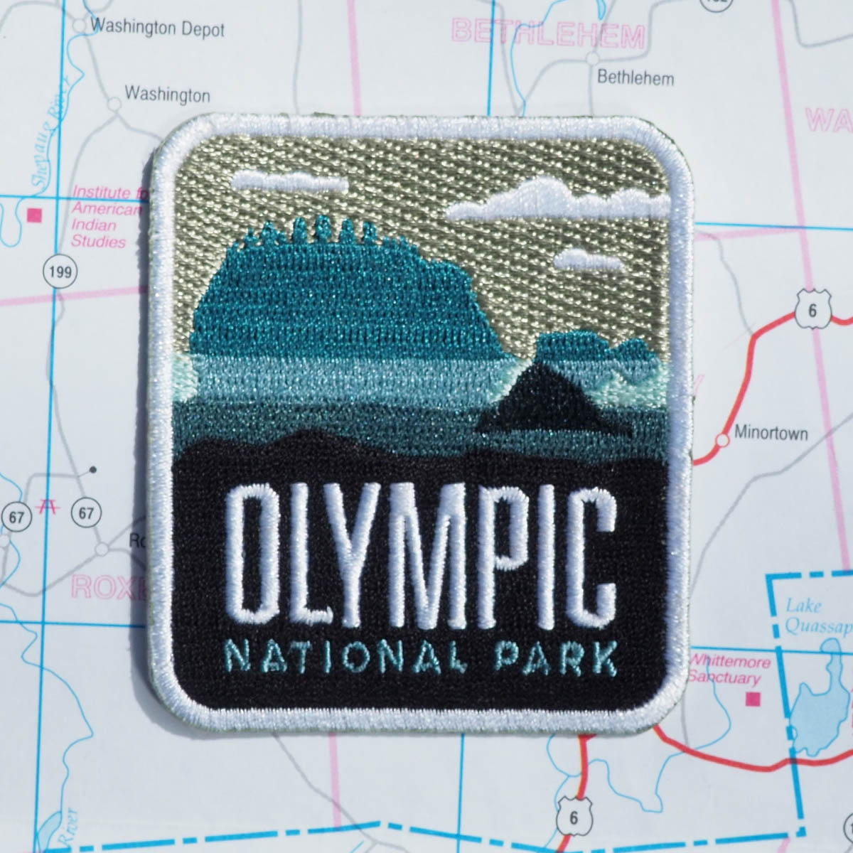 Olympic patch on a map background