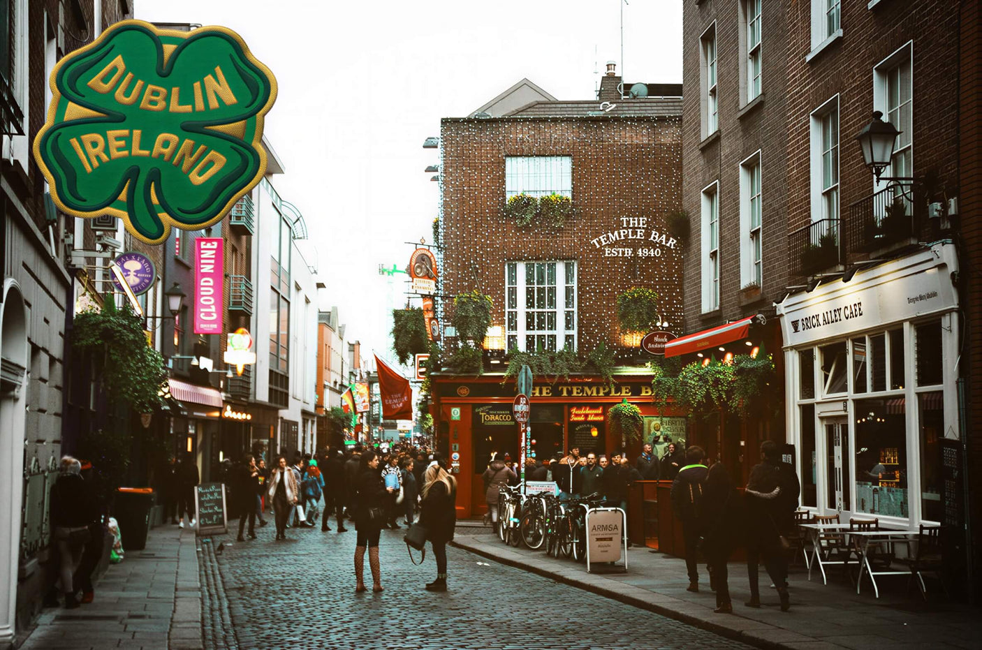 Dublin Ireland sticker featuring a green shamrock design with a vibrant street scene in the background.