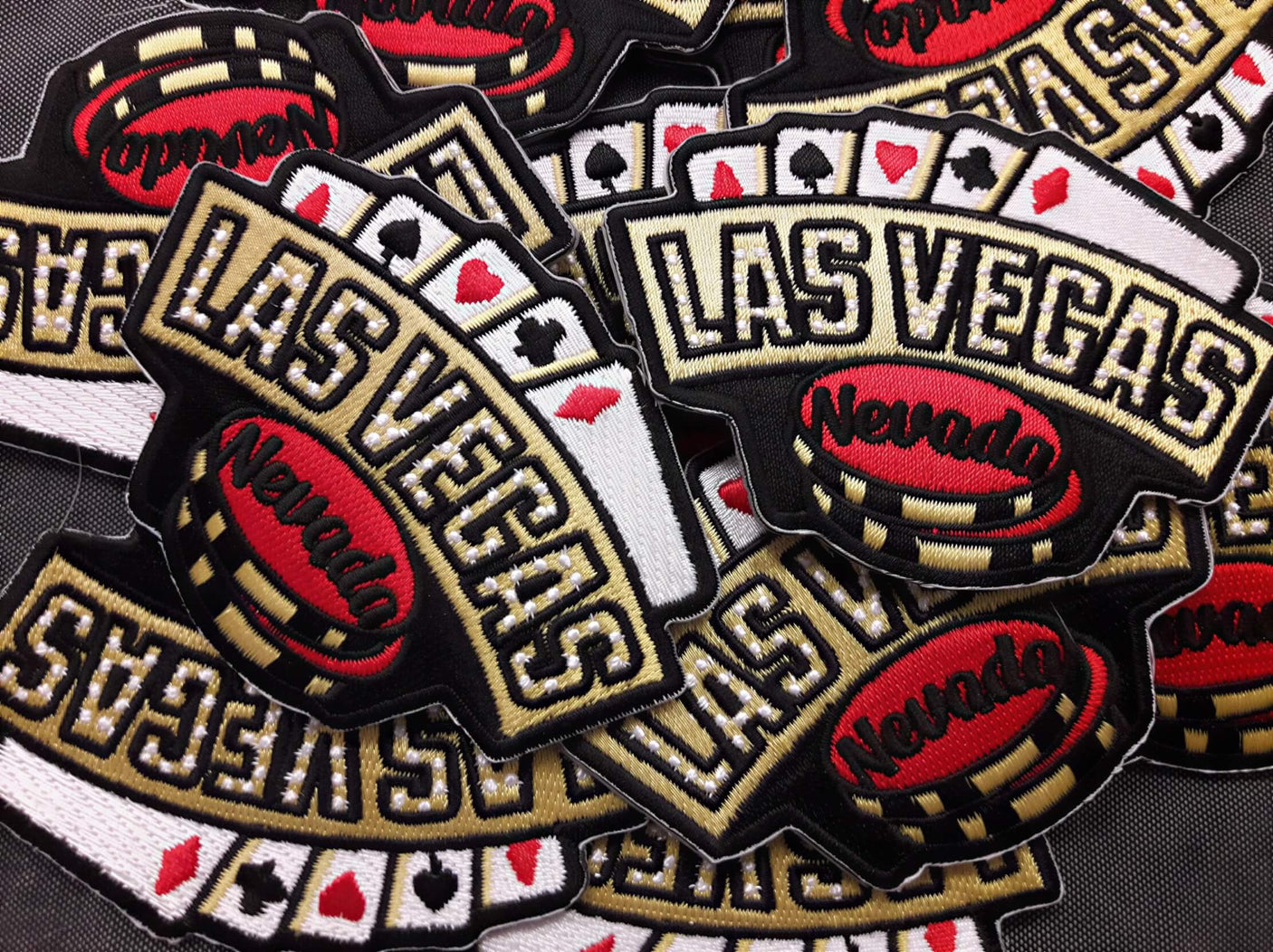 Las Vegas patch featuring black, red, and white colors with poker chips and "Nevada" text.