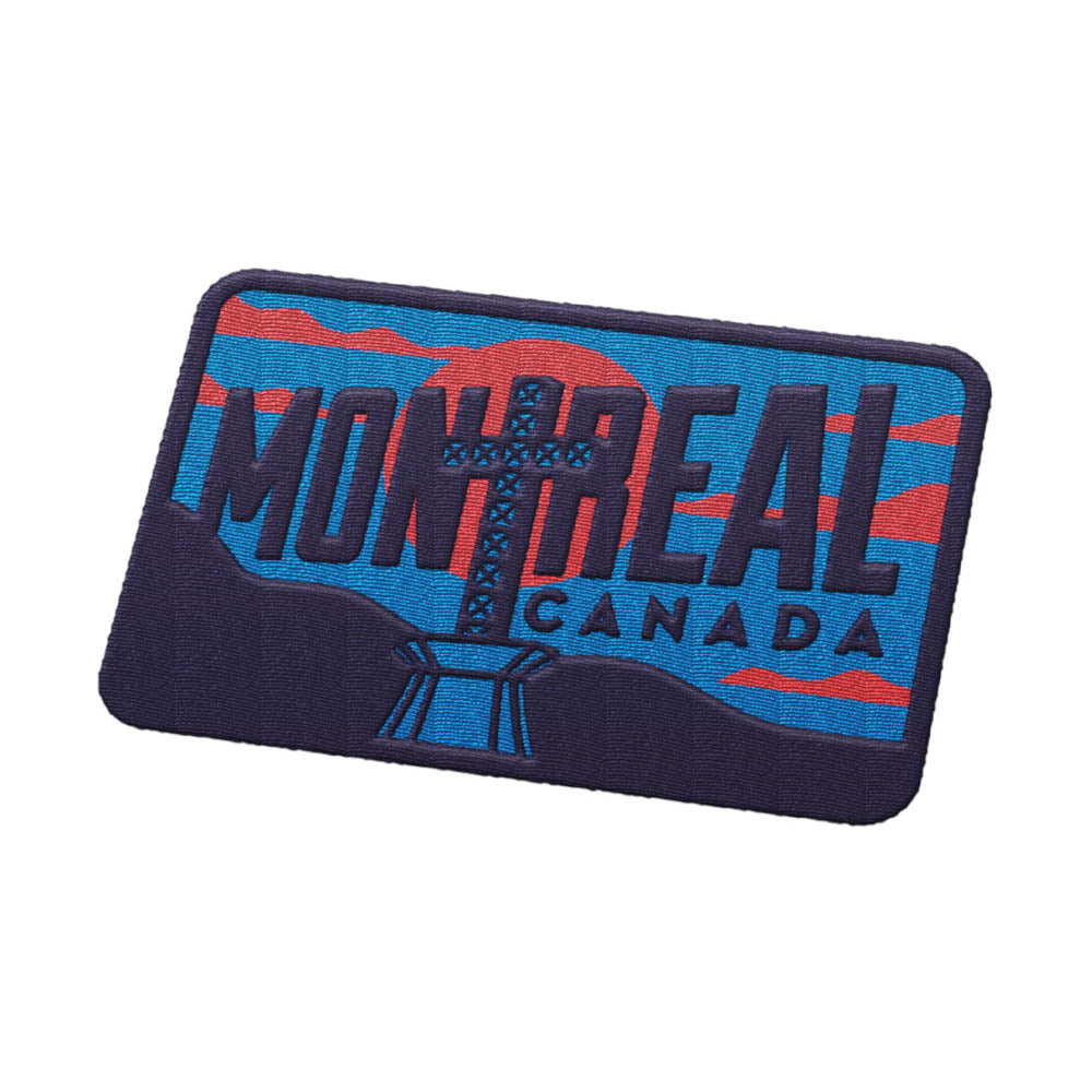 Montreal Quebec patch featuring bold blue and red design with text and a graphic of a cross structure.