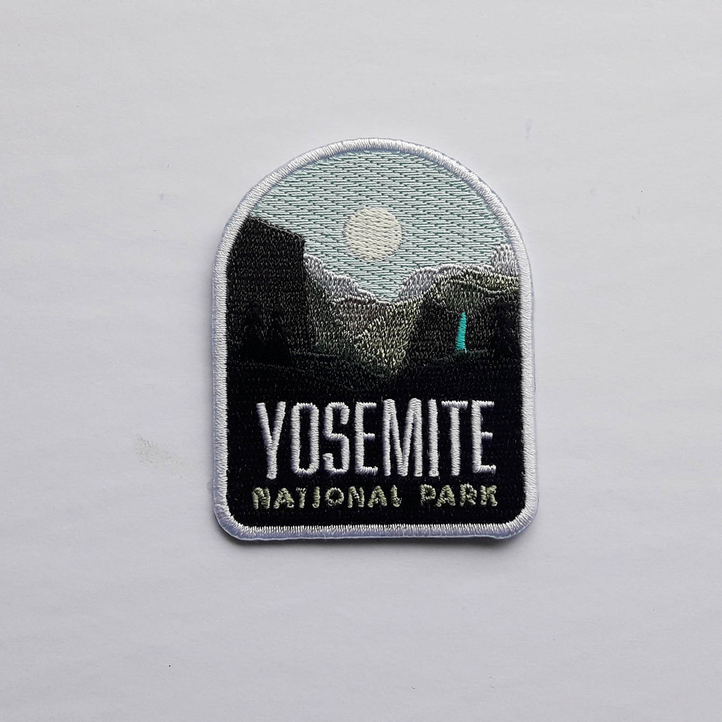 Yosemite National Park patch featuring a mountain landscape, moon, and embroidered text in black and white.
