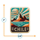 Chile patch featuring mountains, water, and sun in vibrant colors, measuring 3 inches by 2.25 inches.