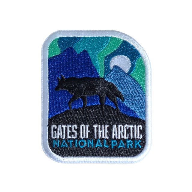Gates of the Arctic National Park patch featuring a wolf silhouette against mountains and a moonlit sky.