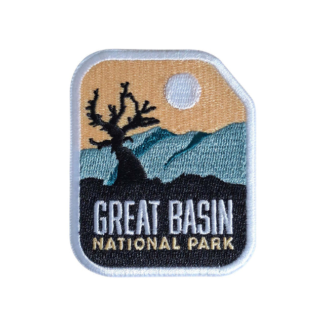 Great Basin National Park patch featuring a silhouette tree, mountains, and a sunset background.