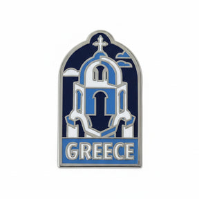 Greece enamel pin featuring a blue and white church design with the word "Greece" at the bottom.