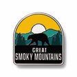 Great Smoky Mountain National Park enamel pin featuring a bear silhouette, mountains, and a yellow sun background.