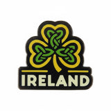 Ireland enamel pin featuring a green and yellow shamrock design with the word "IRELAND" in white text below.