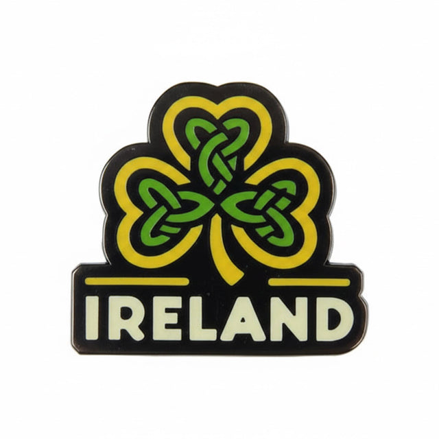 Ireland enamel pin featuring a green and yellow shamrock design with the word "IRELAND" in white text below.