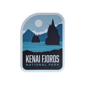 Kenai Fjords National Park sticker featuring blue mountains, a lake, and the park name in bold black text.