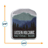 Lassen Volcanic National Park patch featuring mountains and trees in green and blue with white border.