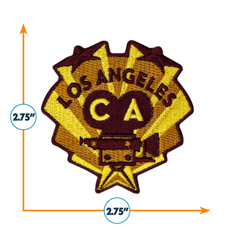 Los Angeles California patch with a maroon and yellow design, featuring the text "LOS ANGELES" and "CA" above a camera icon.