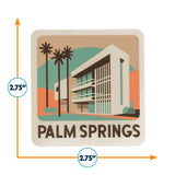 Palm Springs sticker featuring a modern building, palm trees, and a colorful background, measuring 2.75 inches square.