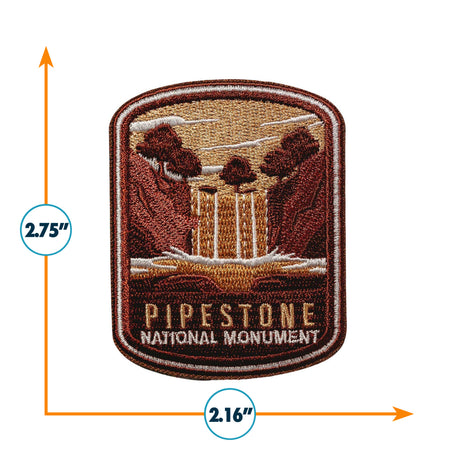 Pipestone National Monument iron-on patch featuring a waterfall and trees in earthy tones, measuring 2.75 by 2.16 inches.