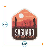 Saguaro National Park sticker featuring cacti and a sunset background, measuring 2.75 inches by 2.25 inches.