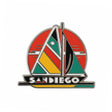 San Diego enamel pin featuring a colorful sailboat design with red, green, yellow, and black elements.