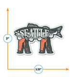 Seattle magnet featuring a fish held by two hands, measuring 3.25 inches wide and 2 inches tall.