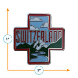 Switzerland enamel pin featuring a red cross design with mountains, clouds, and the word "Switzerland" in bold letters.