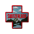 Switzerland patch featuring a red cross, mountains, and clouds with "SWITZERLAND" text in bold red.