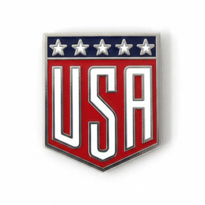 USA pin with a red shield design, featuring white letters and five stars in blue at the top.