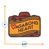 Vagabond Heart sticker featuring a suitcase design with yellow and red colors, measuring 2 by 2.75 inches.