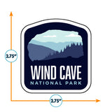Wind Cave National Park sticker featuring a blue and white mountain landscape with text below in bold white letters.