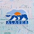 Alaska sticker on a map background