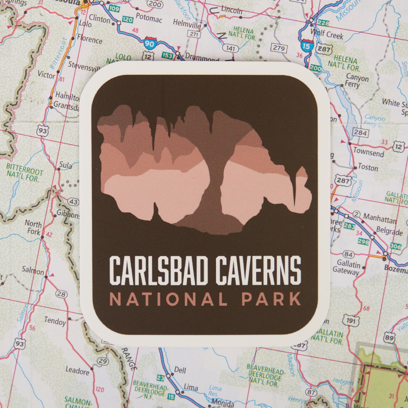 BONUS National Park sticker featuring Carlsbad Caverns design on a map background.