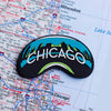 Chicago fridge magnet on a map background
