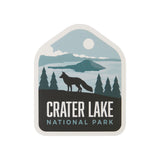 Crater Lake National Park sticker featuring a silhouette of a fox against a lake and mountain backdrop.