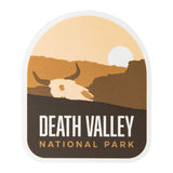Death Valley National Park sticker featuring a skull silhouette against a sunset backdrop in earthy tones.