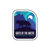 BONUS National Park sticker featuring a silhouette of a wolf against mountains and a moon, with vibrant blue and green col...
