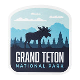 Grand Teton National Park sticker featuring a moose silhouette against mountains and trees in blue and green hues.