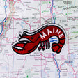Maine patch on a map background