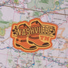 Nashville sticker on a map background