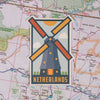 Netherlands sticker on a map background