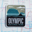 Olympic patch on a map background