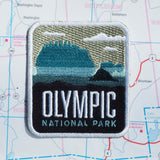 Olympic patch on a map background