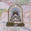 Osaka sticker on a map background