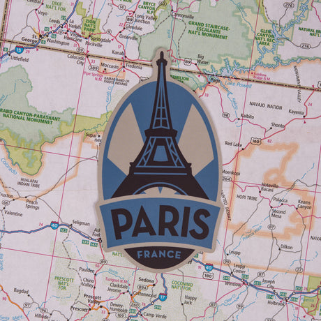 Paris sticker on a map background